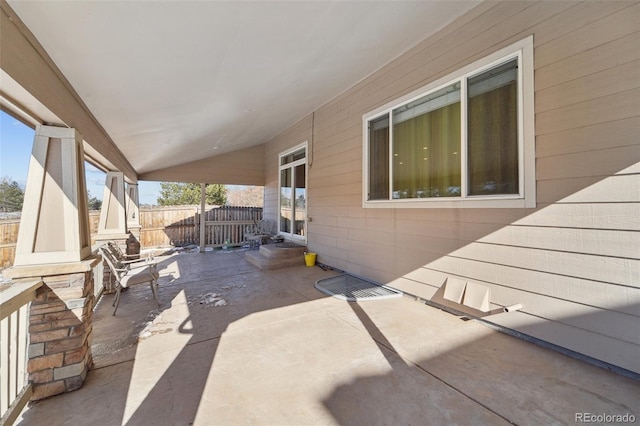 view of patio / terrace featuring fence