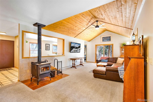 757 Thompson Park Rd, Fairplay, CO 80440 - carpeted living room with a wood stove, wooden ceiling, a ceiling fan, lofted ceiling, and baseboards
