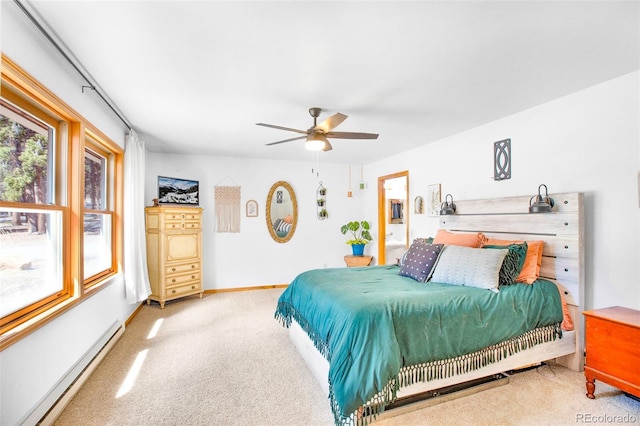 757 Thompson Park Rd, Fairplay, CO 80440 - bedroom with a baseboard heating unit, light colored carpet, a ceiling fan, and baseboards