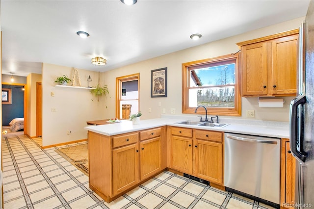 757 Thompson Park Rd, Fairplay, CO 80440 - kitchen with dishwasher, a sink, a peninsula, light countertops, and light flooring