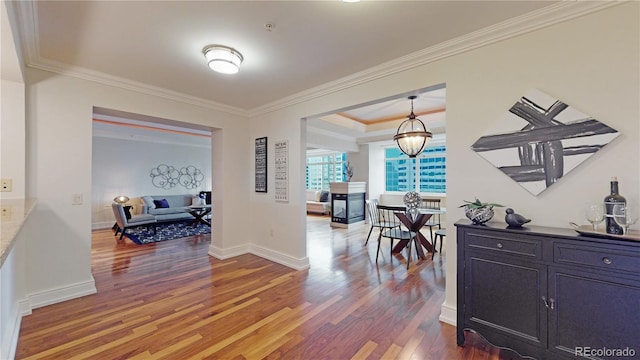 corridor featuring dark hardwood / wood-style flooring and ornamental molding