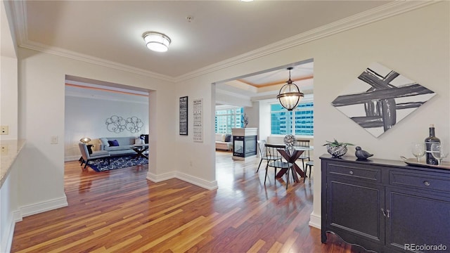 1891 Curtis St Unit 1613, Denver, CO 80202 - hall featuring wood finished floors, ornamental molding, and baseboards