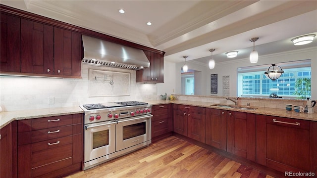 1891 Curtis St Unit 1613, Denver, CO 80202 - kitchen with wall chimney range hood, double oven range, ornamental molding, tasteful backsplash, and light wood-style floors