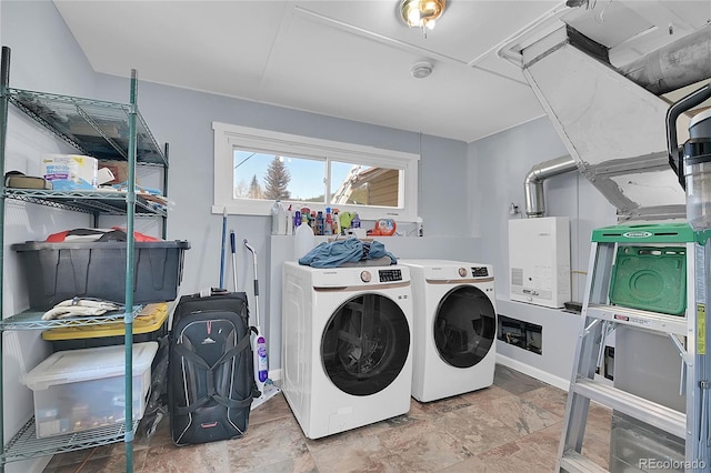 124 River Dr, Bailey, CO 80421 - clothes washing area featuring separate washer and dryer and stone finish floors