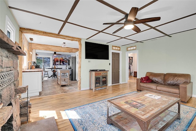 124 River Dr, Bailey, CO 80421 - living area with a ceiling fan, light wood-style floors, and baseboards