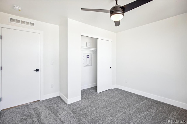 unfurnished bedroom featuring a closet, carpet, visible vents, and baseboards