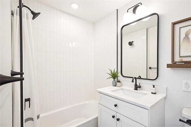 bathroom with shower / tub combo with curtain, vanity, and toilet