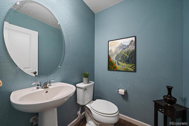 bathroom featuring sink and toilet