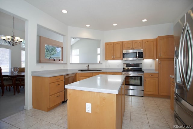 2608 S Troy Ct, Aurora, CO 80014 - kitchen with appliances with stainless steel finishes, a center island, a chandelier, light countertops, and a sink