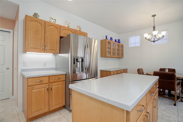 2608 S Troy Ct, Aurora, CO 80014 - kitchen with stainless steel fridge with ice dispenser, a chandelier, glass insert cabinets, light countertops, and pendant lighting