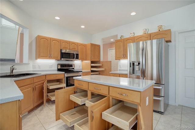 2608 S Troy Ct, Aurora, CO 80014 - kitchen featuring stainless steel appliances, a sink, a center island, light tile patterned floors, and recessed lighting
