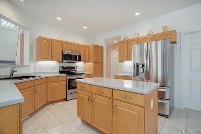 2608 S Troy Ct, Aurora, CO 80014 - kitchen with appliances with stainless steel finishes, a sink, a kitchen island, light tile patterned flooring, and recessed lighting