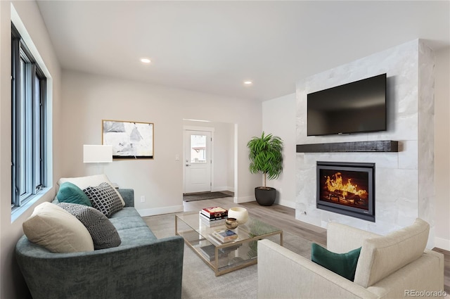 1103 Lupine Ln, Tabernash, CO 80478 - living room featuring baseboards, recessed lighting, wood finished floors, and a large fireplace