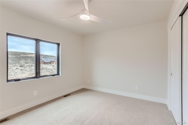 1103 Lupine Ln, Tabernash, CO 80478 - unfurnished room featuring baseboards, ceiling fan, visible vents, and light carpet