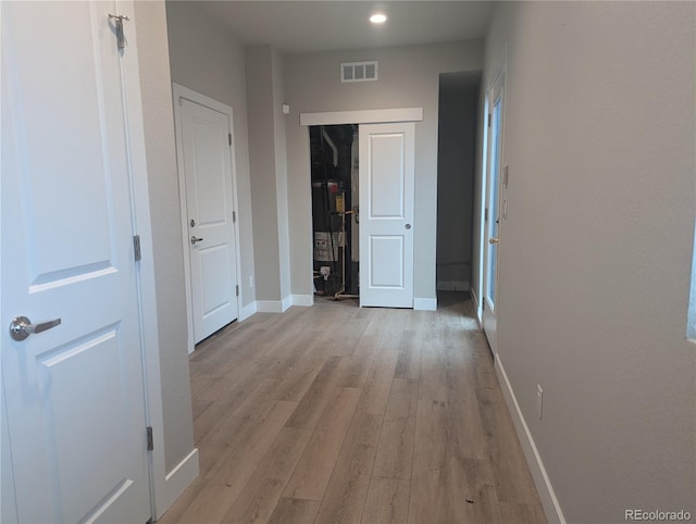 corridor featuring light hardwood / wood-style flooring