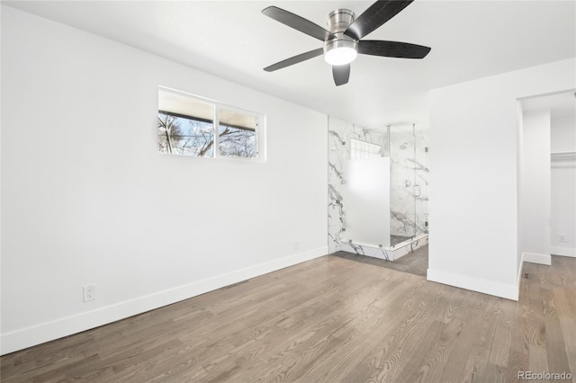 unfurnished bedroom with a ceiling fan, baseboards, and wood finished floors