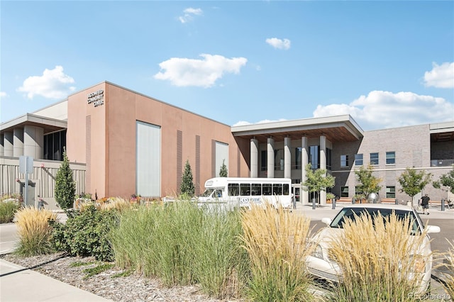 view of building exterior with fence