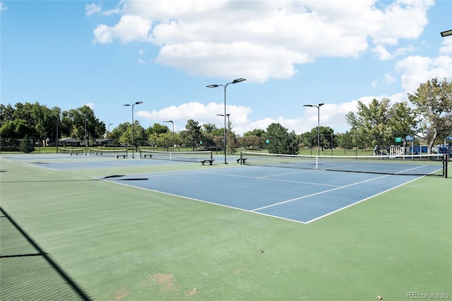 view of sport court with fence