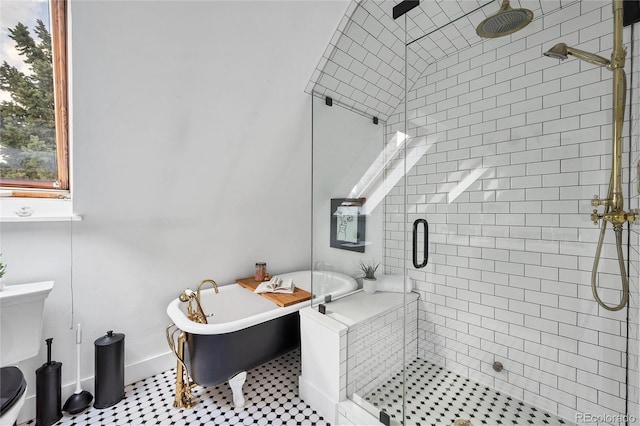 bathroom featuring tile patterned flooring and separate shower and tub