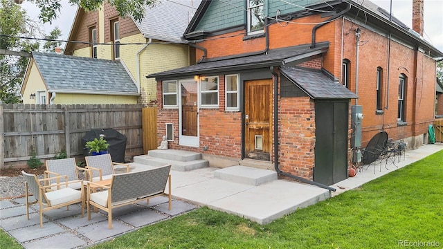 back of property with a patio area