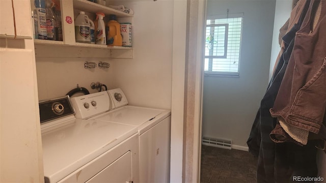 laundry room with visible vents and washing machine and dryer