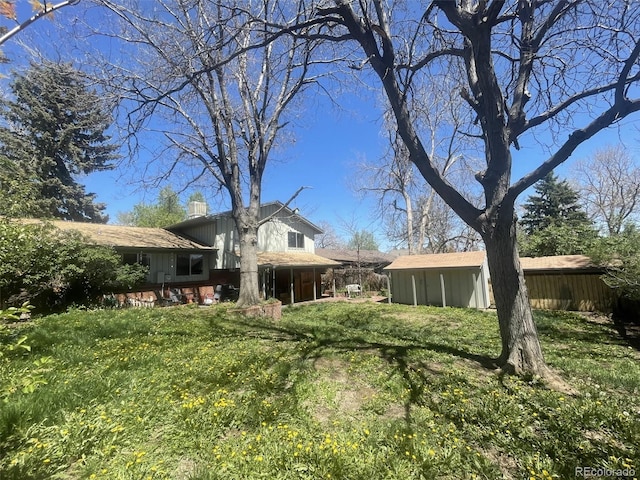 view of yard with a sunroom