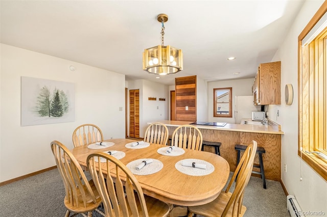 9430 Ryan Gulch Rd Unit 9450, Silverthorne, CO 80498 - dining area featuring light colored carpet, a baseboard radiator, a chandelier, baseboards, and recessed lighting