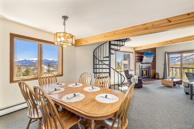 9430 Ryan Gulch Rd Unit 9450, Silverthorne, CO 80498 - carpeted dining space featuring a chandelier, stairway, a lit fireplace, and a baseboard radiator