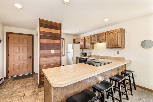9430 Ryan Gulch Rd Unit 9450, Silverthorne, CO 80498 - kitchen with light countertops, freestanding refrigerator, dishwasher, stainless steel microwave, and baseboards