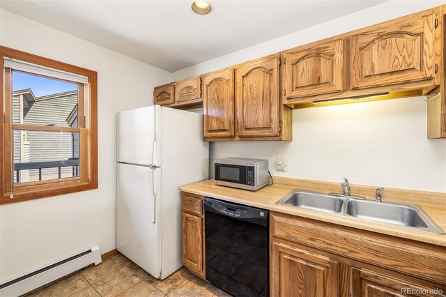 9430 Ryan Gulch Rd Unit 9450, Silverthorne, CO 80498 - kitchen featuring black dishwasher, a baseboard radiator, stainless steel microwave, a sink, and freestanding refrigerator