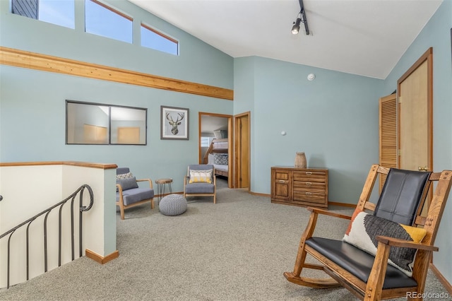 9430 Ryan Gulch Rd Unit 9450, Silverthorne, CO 80498 - living area featuring carpet, baseboards, and high vaulted ceiling