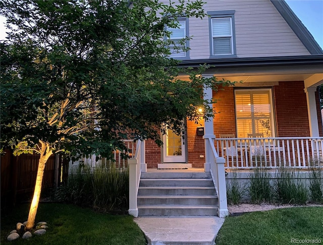 doorway to property with a porch