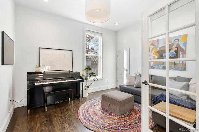 sitting room featuring dark hardwood / wood-style flooring