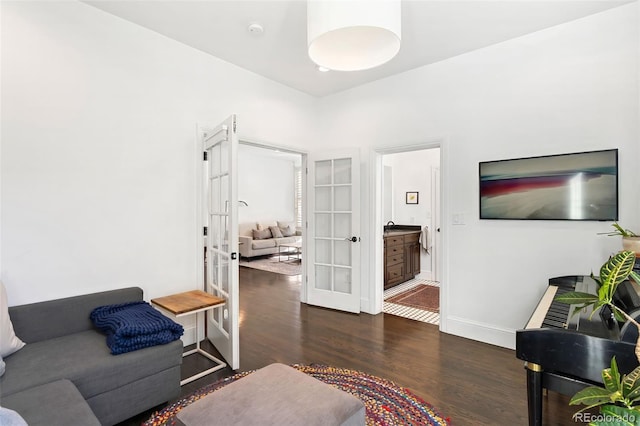 living room with french doors and dark hardwood / wood-style floors