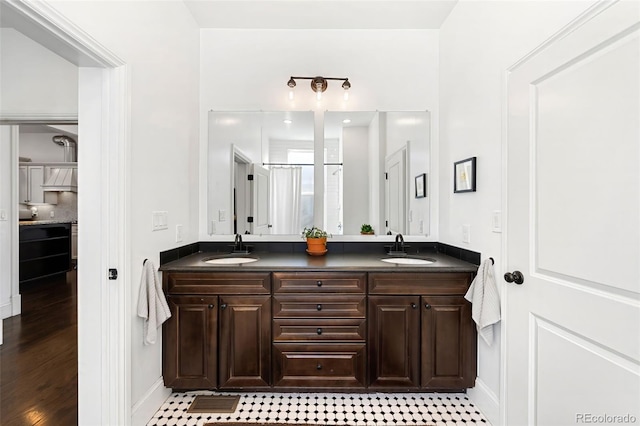 bathroom with a shower and vanity