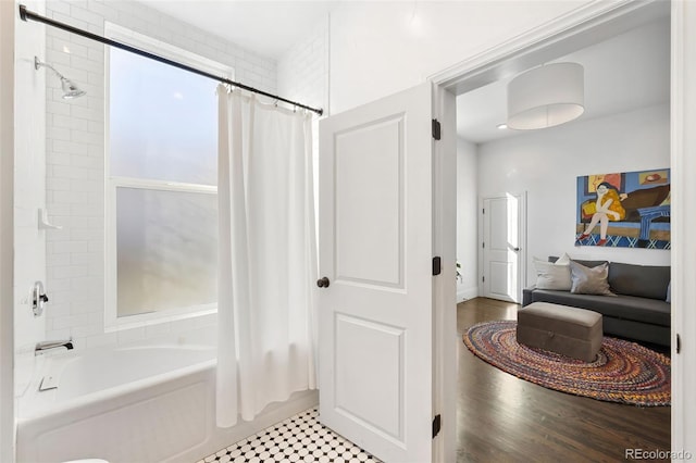 bathroom featuring shower / bathtub combination with curtain