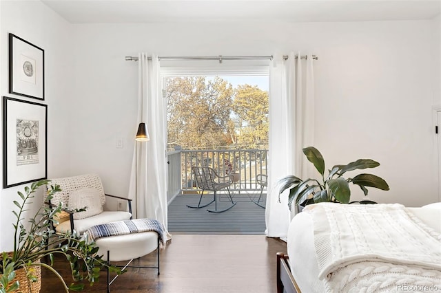 bedroom with hardwood / wood-style flooring and access to exterior