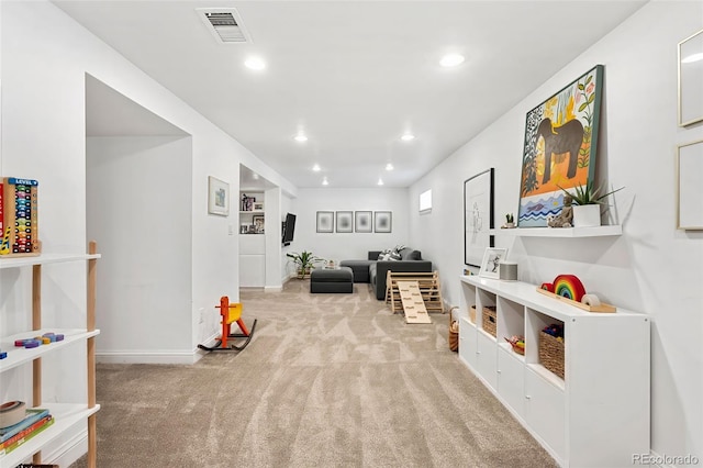 playroom featuring light colored carpet