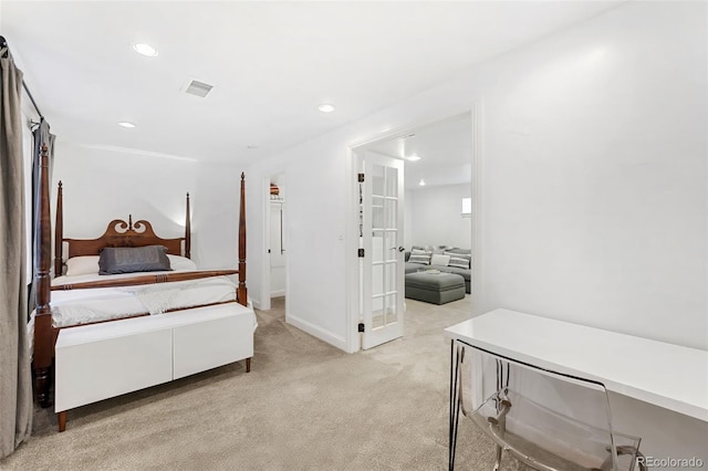 bedroom with light carpet and french doors