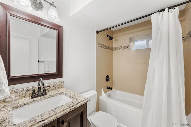 full bathroom with shower / bath combo with shower curtain, vanity, and toilet