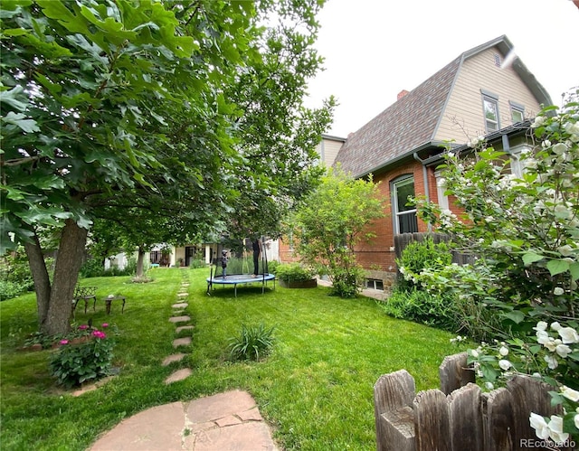 view of yard with a trampoline