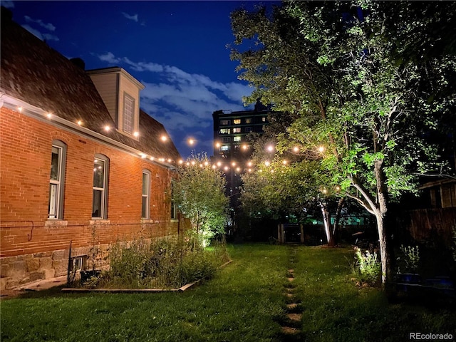 view of yard at twilight