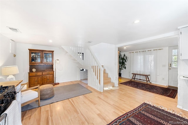 entryway with wood-type flooring