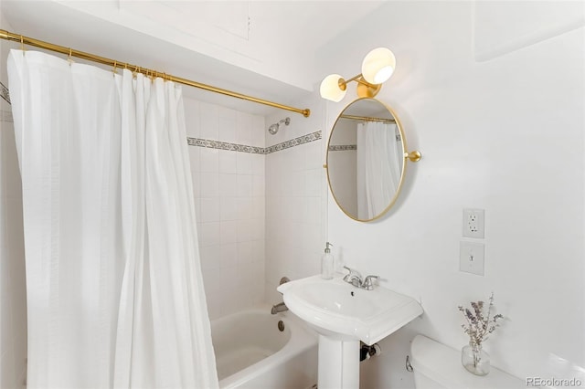 bathroom with toilet and shower / tub combo with curtain