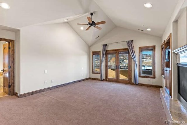 unfurnished living room featuring ceiling fan, carpet flooring, and high vaulted ceiling