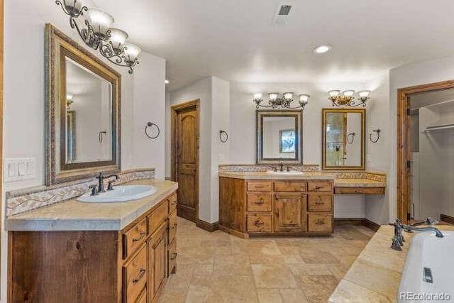 bathroom featuring vanity and a tub to relax in