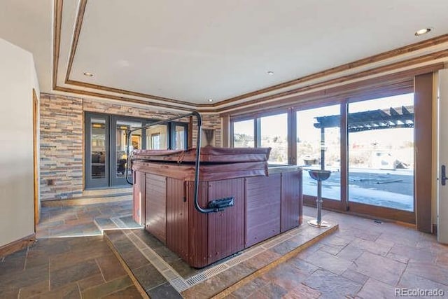 kitchen featuring a raised ceiling and ornamental molding