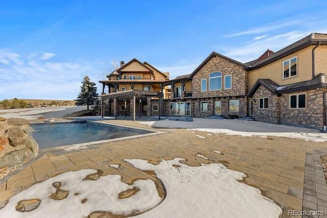 view of pool with a pergola and a patio