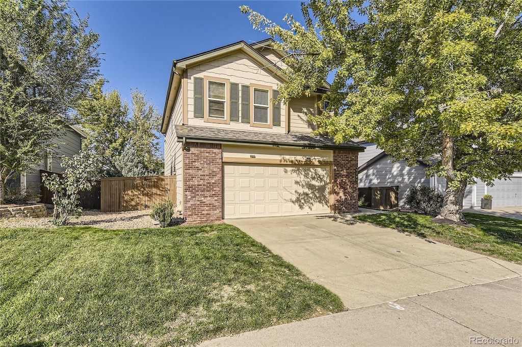 view of front facade featuring a front yard and a garage