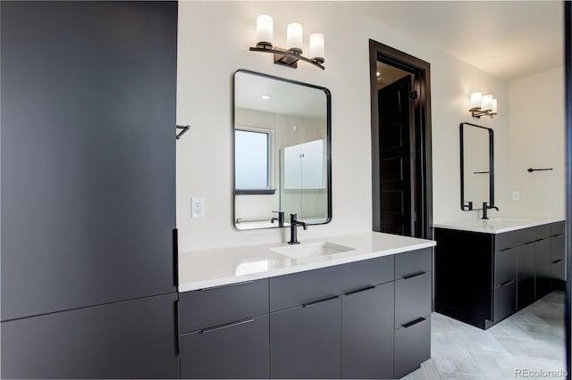 full bathroom featuring a sink and two vanities